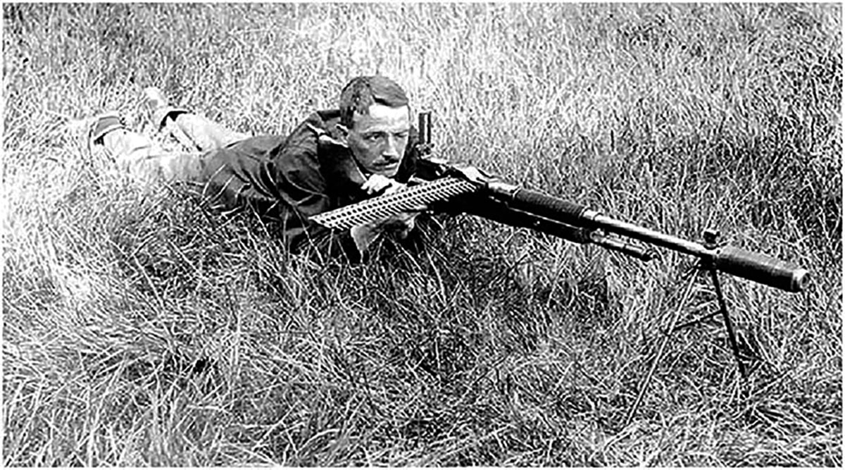 Hiram P. Maxim firing a Hotchkiss M1909 Benet-Mercie machine rifle with his silencer attached to its barrel. The gun was briefly adopted by a number of countries, including the United States, where they were built in 30-06 at Springfield Armory and Colt’s Manufacturing Coompany. (Photo courtesy of Small Arms Review.)